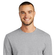 Model wearing Port & Company PC55LST Tall Long Sleeve Core Blend Tee